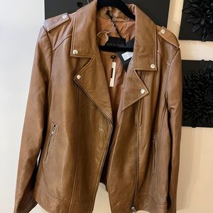 Sly and Company new with tags 100% Ginuwine leather. Lamb. Color is cognac 3X.